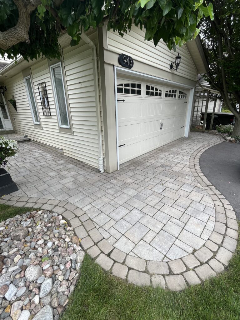 Close-up of intricate circular interlock paver pattern creating a beautiful garden walkway in Clarington