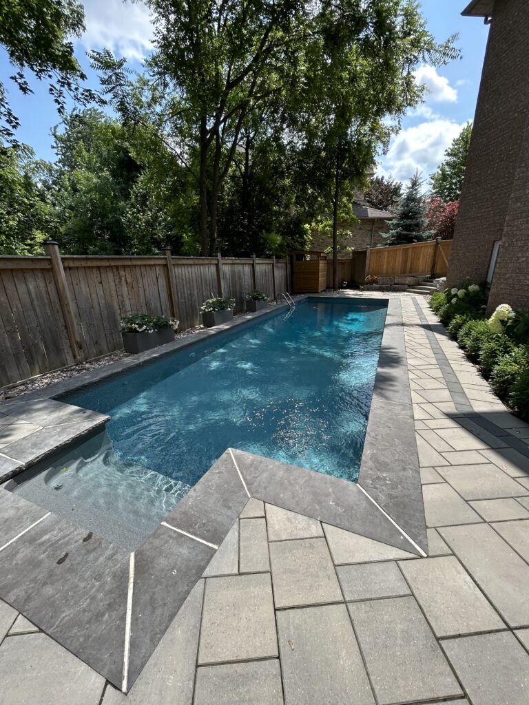 Luxury meets landscape architecture in this ultra-modern pool design for a Durham home, showcasing sharp angles and minimalist aesthetics by Level Above
