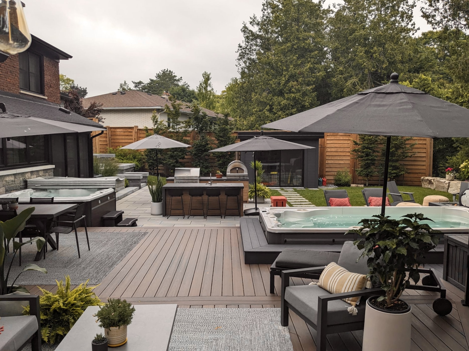 Modern two-tier composite deck built by Level Above in Pickering, ON provides low-maintenance outdoor living.